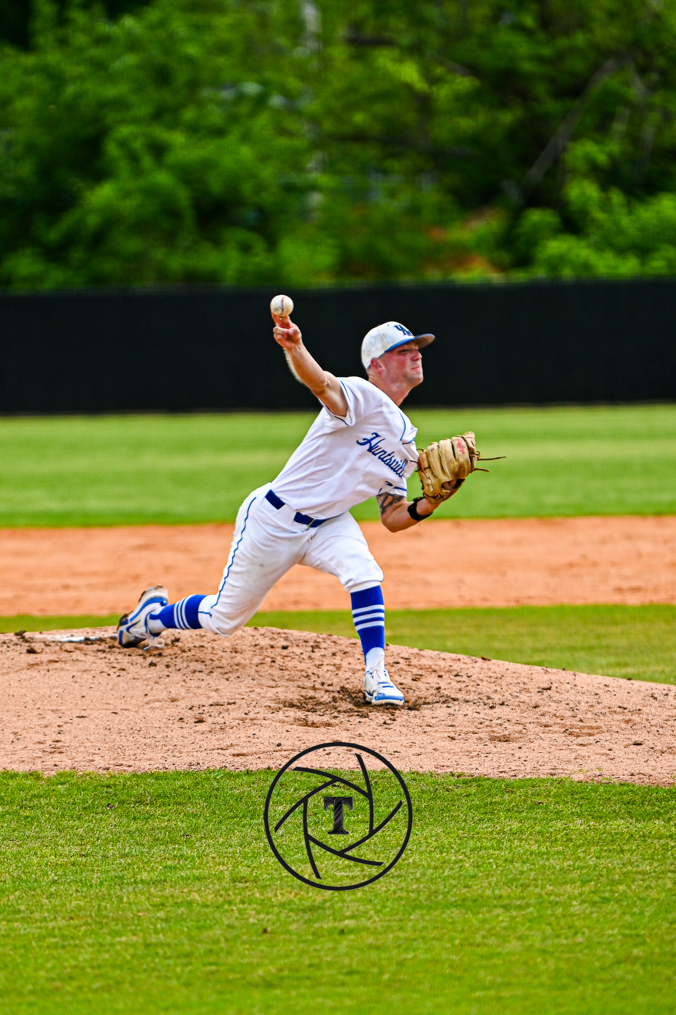 UAH pitcher mid-delivery — TreyCaptures detail frame